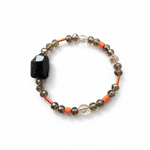Anther House Beaded bracelet with black, orange, and clear beads on a white background Made in Philly