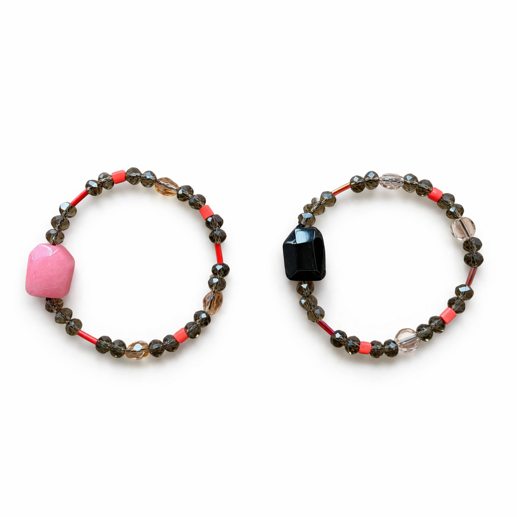 Anther House Two beaded bracelets with pink, black, and brown beads on a white background Made in Philly