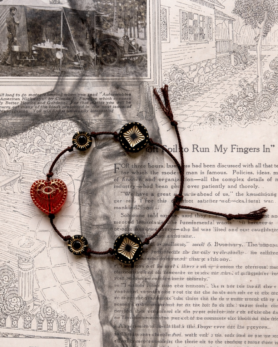 Anther House Bracelet with red heart Czech charm on a textured background with text and vintage elements