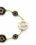 Anther House Necklace with black, gold, and white beads on a white background Handmade in Philadelphia
