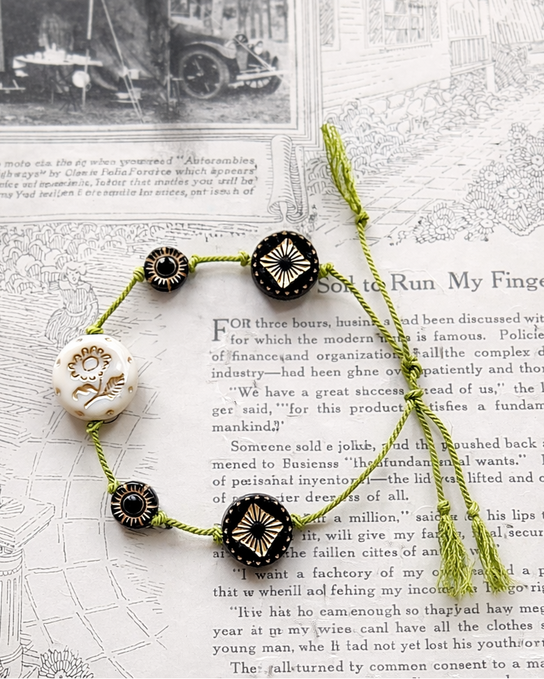 Anther House Bracelet with decorative beads on a vintage book page Handmade in Philadelphia