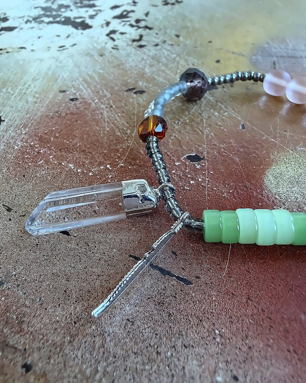 Anther House Close-up of a fishing lure with beads on a textured surface Handmade in Philly