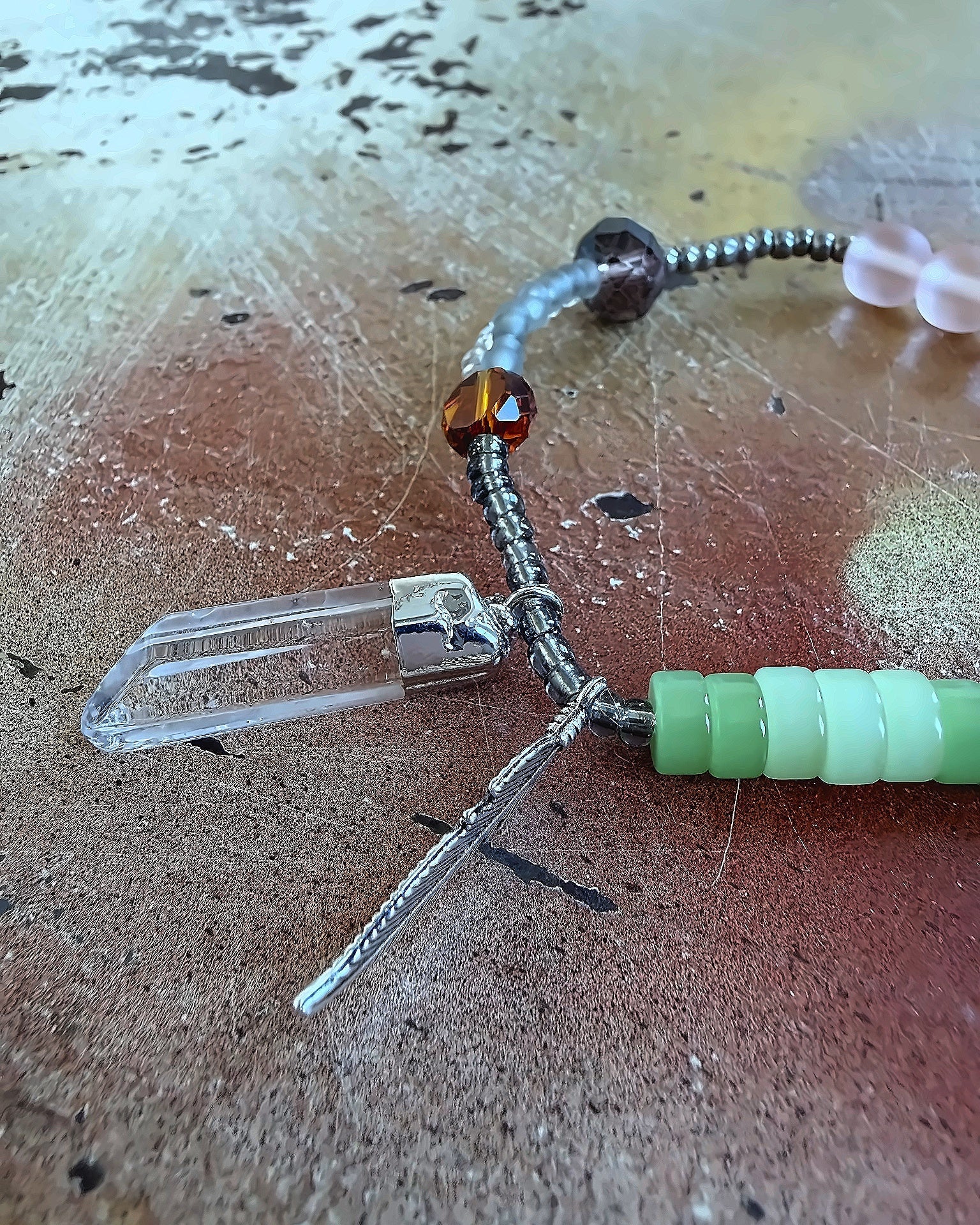 Anther House Close-up of a fishing lure with beads on a textured surface Handmade in Philly