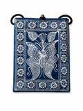 Indigo dyed artisan textile pouch featuring Chinese heritage inspired patterns, woven details, and vintage style closure