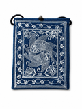 Indigo dyed artisan textile pouch featuring Chinese heritage inspired patterns, woven details, and vintage style closure
