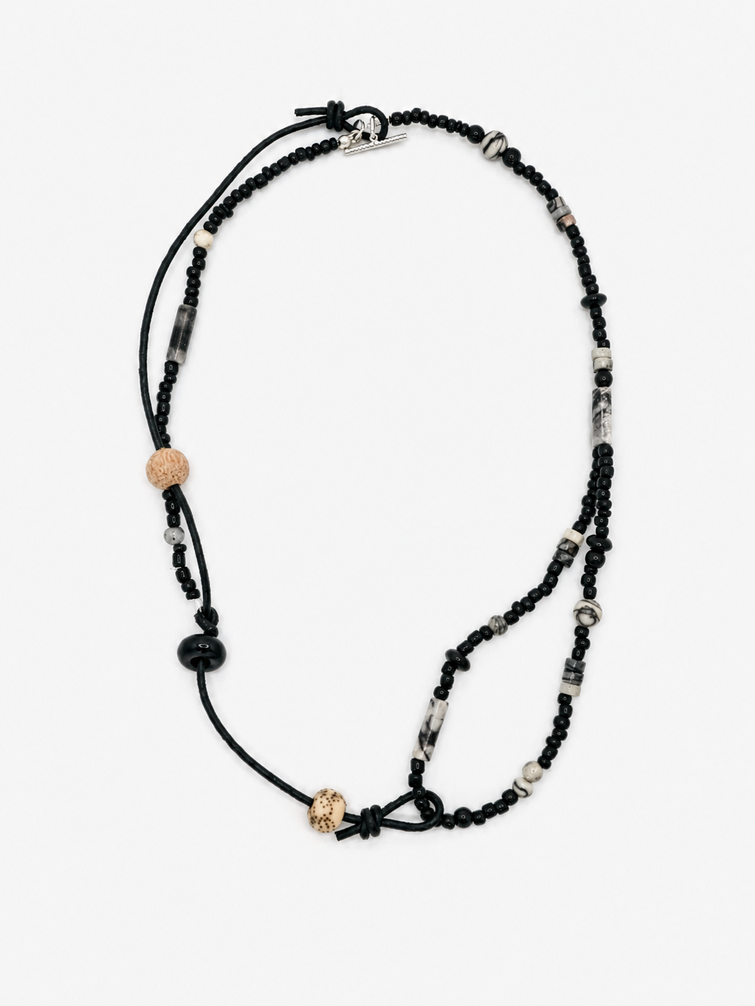 Black Stone & Cord Beaded Necklace featuring handmade layered design, textured beads, and knotted cord details