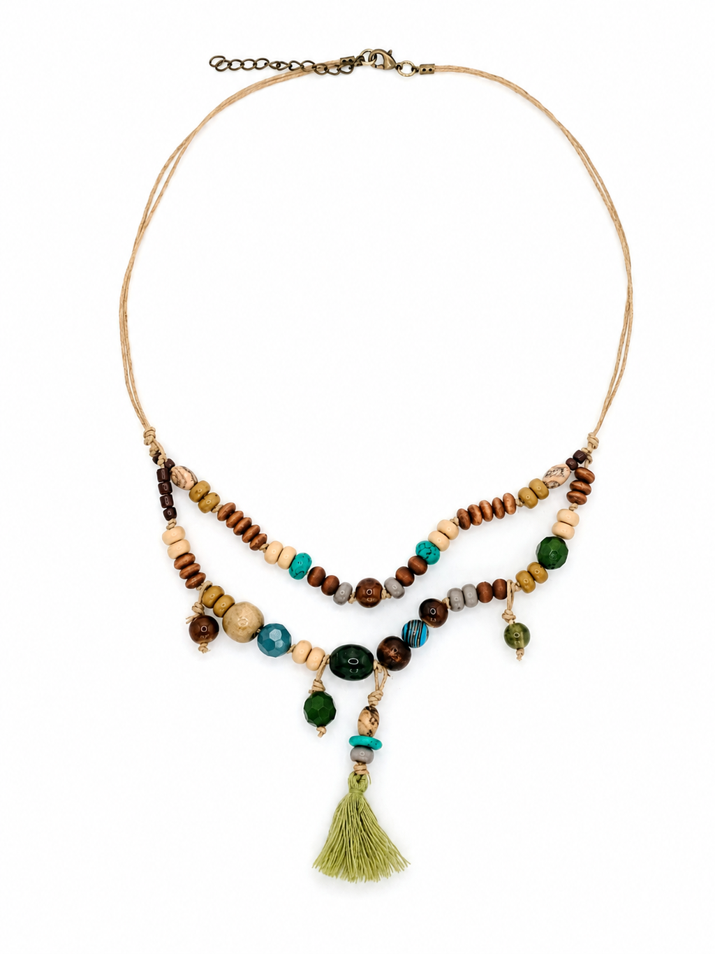Handcrafted mixed bead tassel necklace with earthy tones, natural textures, and artisan cord construction