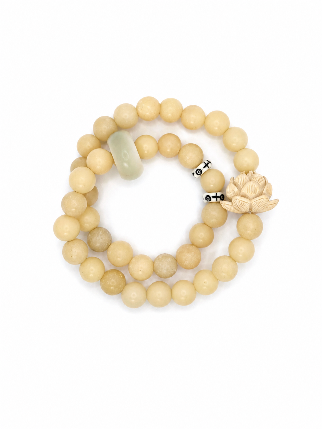 Handmade natural stone beaded bracelet with neutral cream beads, carved lotus charm, and minimalist artisan design
