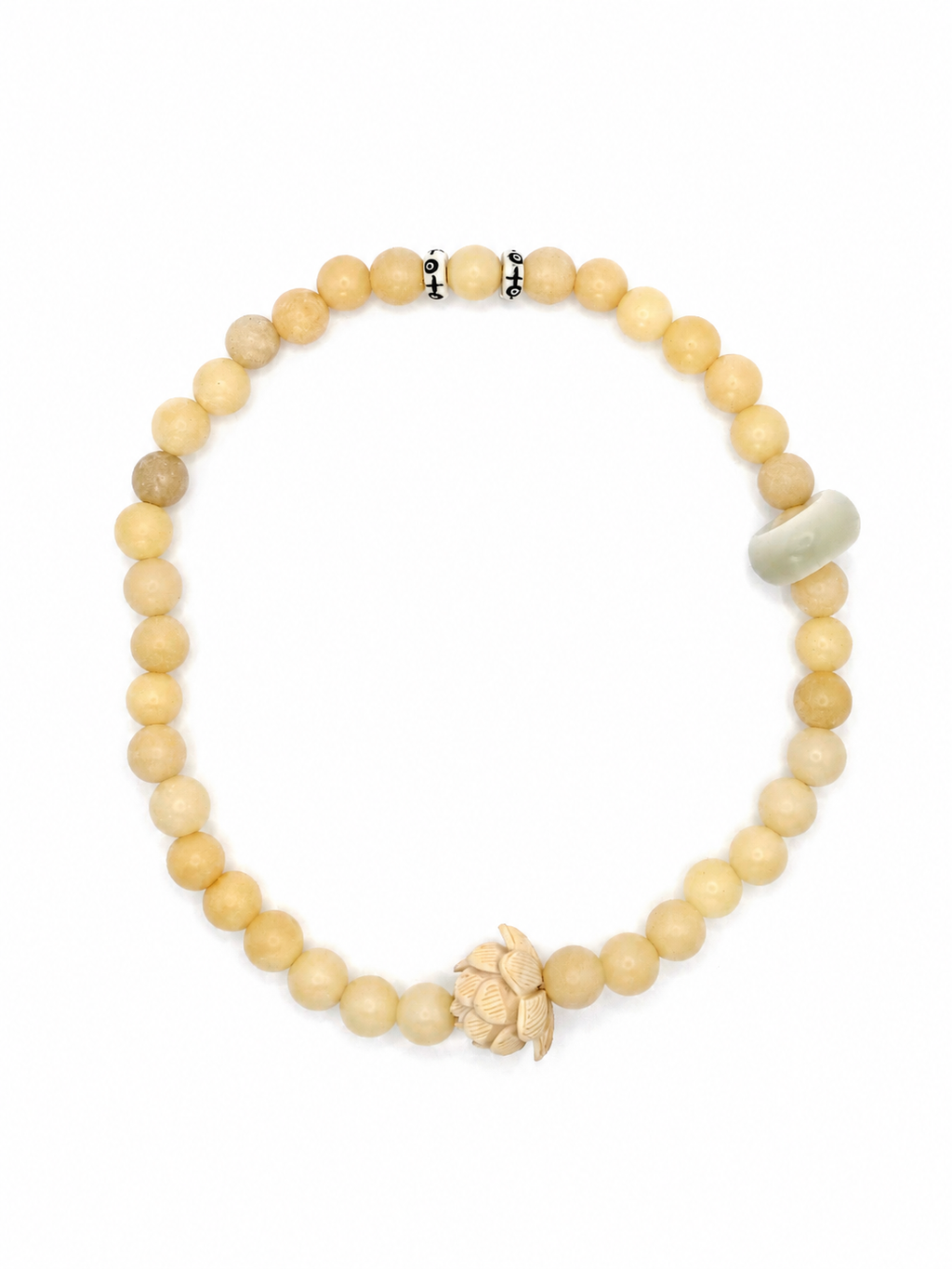 Handmade natural stone beaded bracelet with neutral cream beads, carved lotus charm, and minimalist artisan design