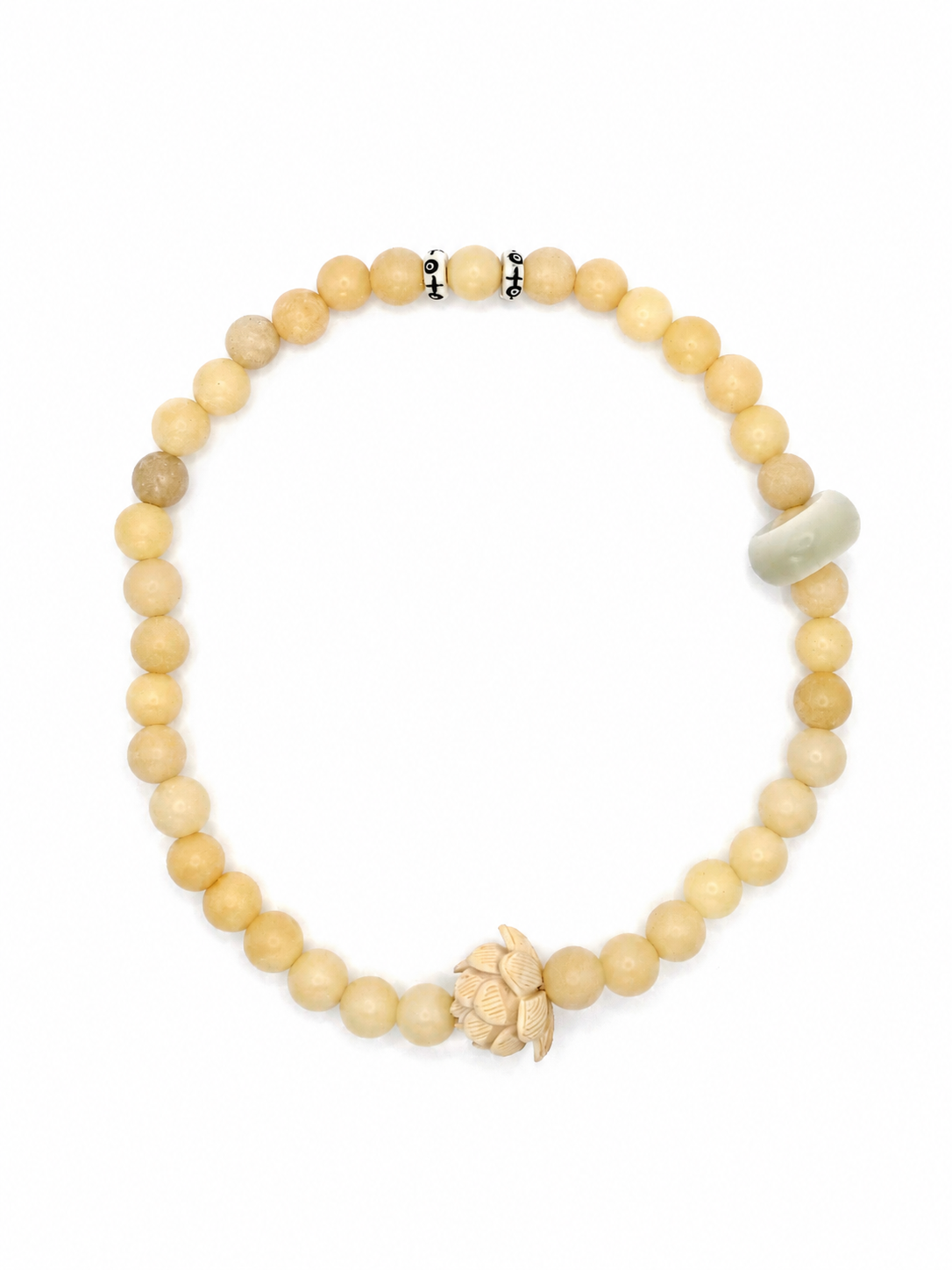 Handmade natural stone beaded bracelet with neutral cream beads, carved lotus charm, and minimalist artisan design
